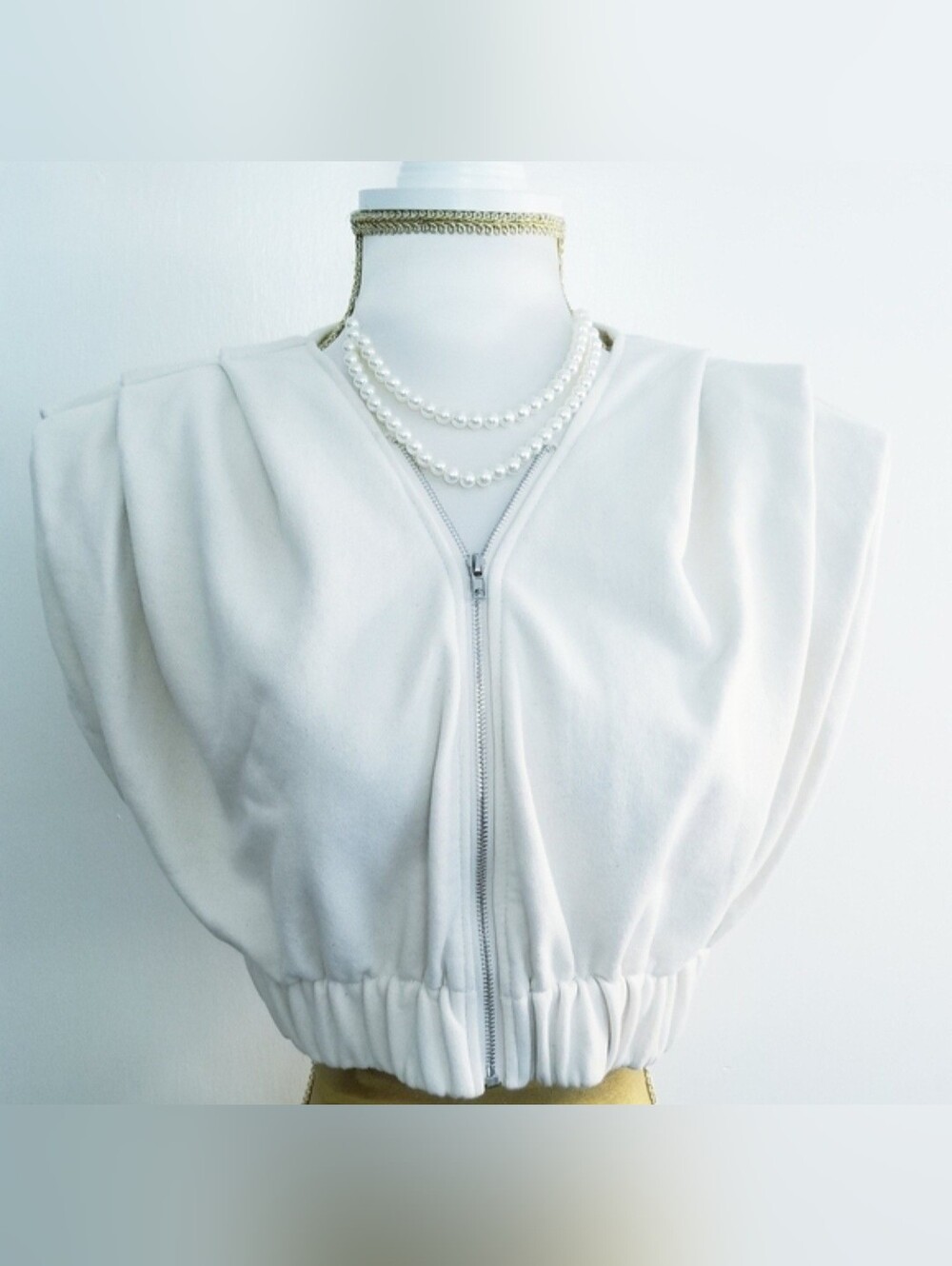 MABLE Cream Cropped Zip-Front Pleated Top with Padded Shoulders